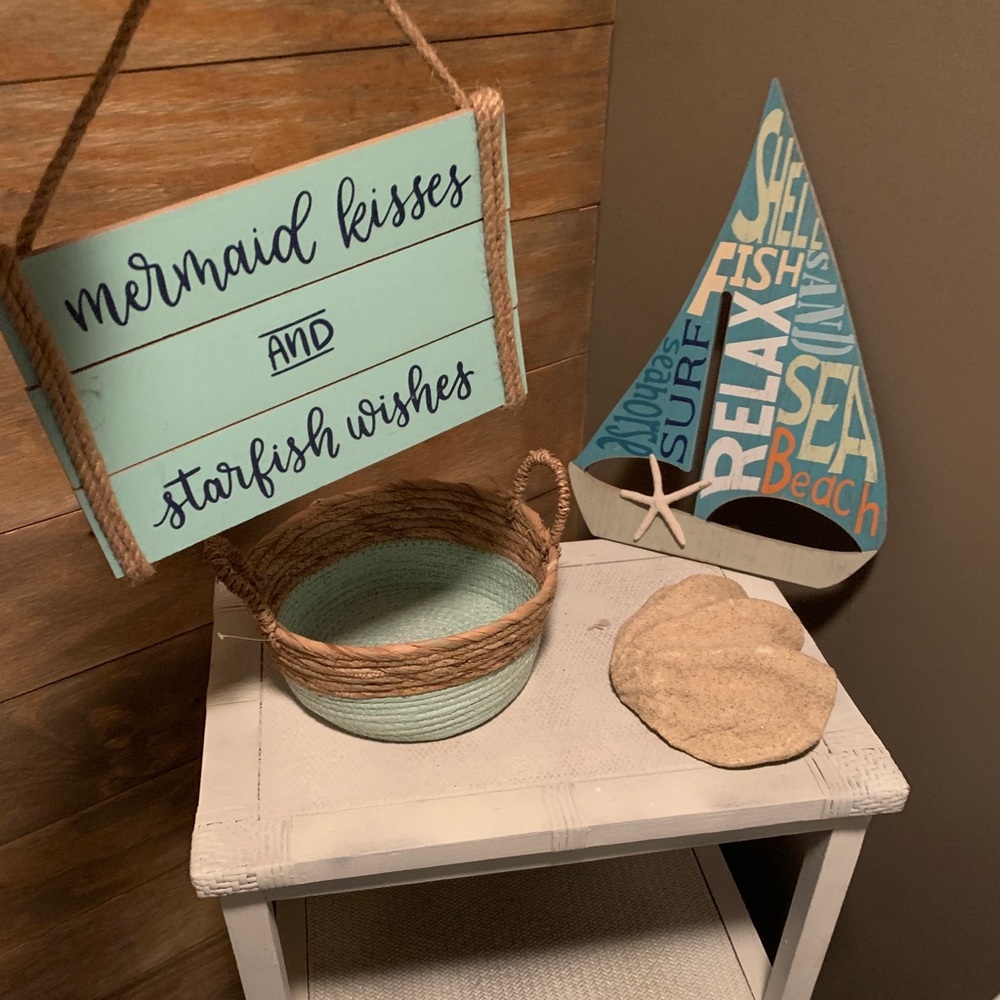Beach decor , two signs , basket , and shell
